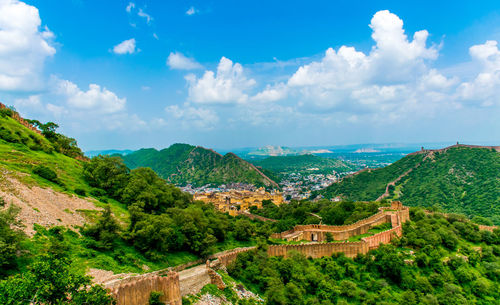 Fort walls, green hills and blue sky