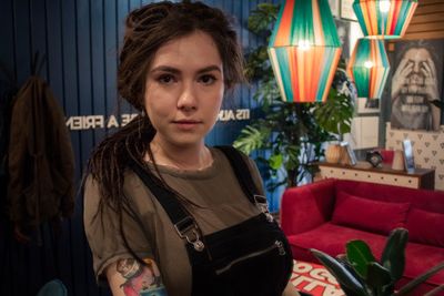 Portrait of young woman sitting outdoors