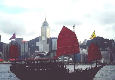 Buildings against cloudy sky
