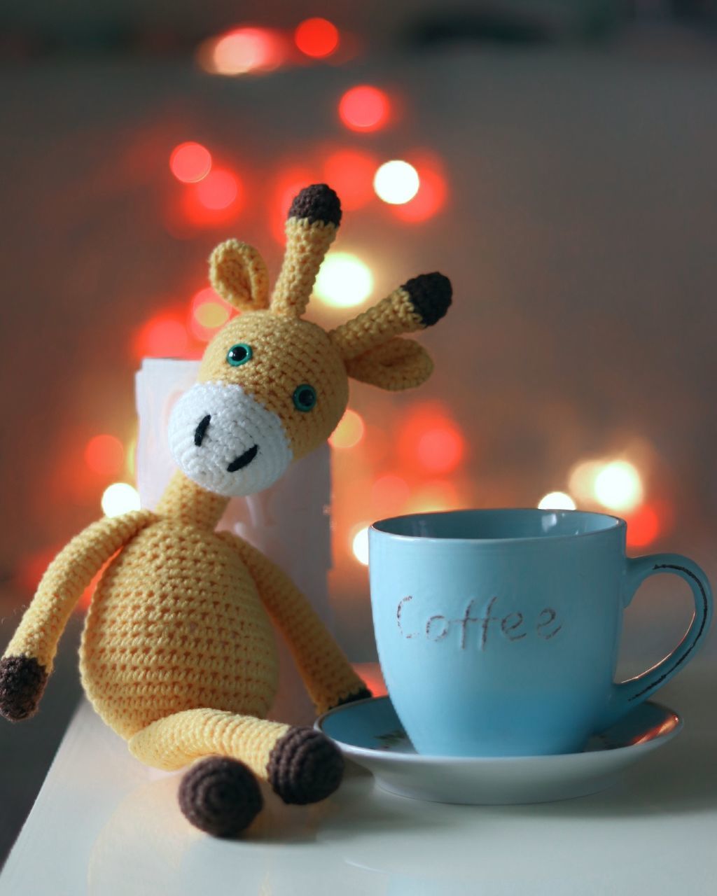 coffee cup, toy, stuffed toy, indoors, still life, teddy bear, christmas, human representation, no people, close-up, celebration, christmas decoration, tradition, celebration event, coffee - drink, childhood, table, focus on foreground, illuminated, day