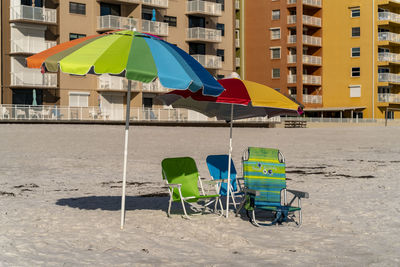 Multi colored chairs on beach