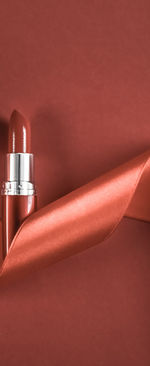 Close-up of beauty products on red background