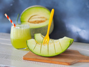 Close-up of melon fruit on table