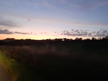 Scenic view of silhouette landscape against sky during sunset