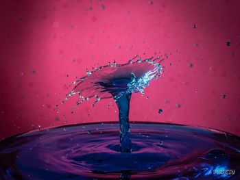 Close-up of drop splashing on water