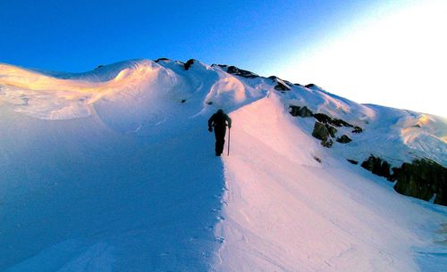 People standing on snow covered landscape