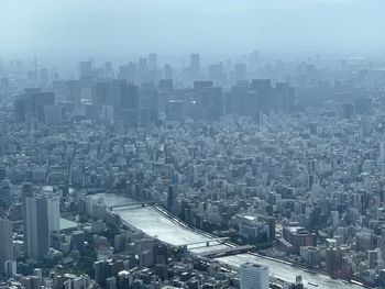 High angle view of buildings in city against sky