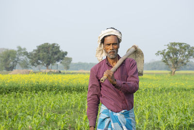 Full length of a man standing in field