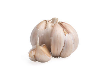 Close-up of garlic against white background