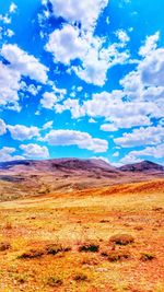 Scenic view of landscape against cloudy sky