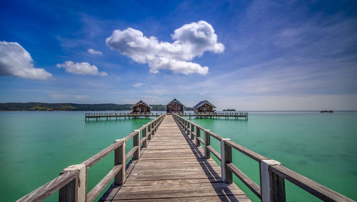 Pier over sea against sky