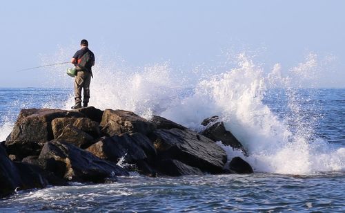 Waves splashing on rocks