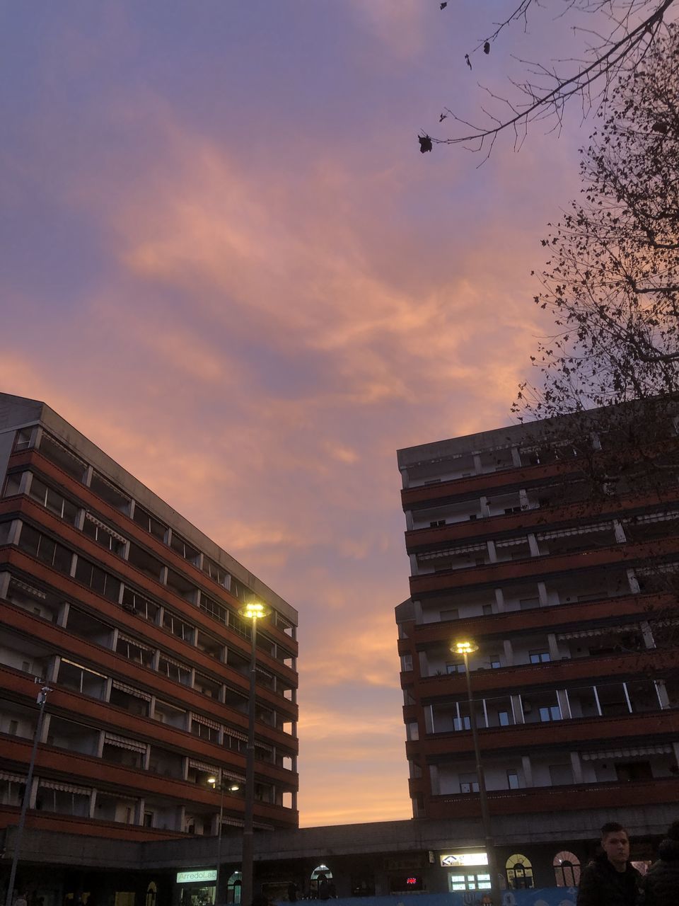 architecture, building exterior, built structure, sky, city, evening, building, skyscraper, light, night, reflection, nature, office building exterior, cloud, cityscape, urban area, no people, low angle view, residential district, metropolitan area, outdoors, illuminated, office, downtown, dusk, city life, sunset, business