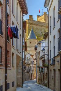 Low angle view of houses amidst buildings in city