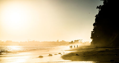 Scenic view of sea against clear sky during sunset