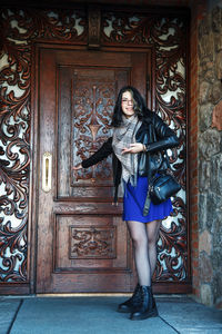 Full length of woman standing in old building