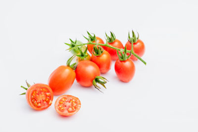 Close-up of tomatoes against white background