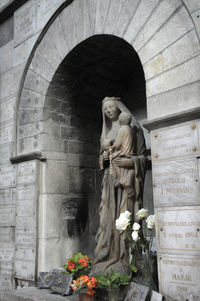 Statue of buddha against building