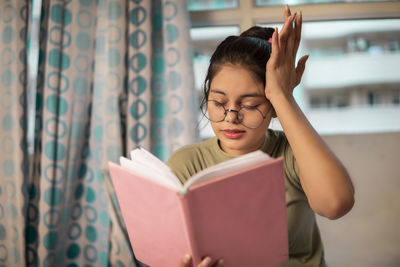 Young woman using digital tablet