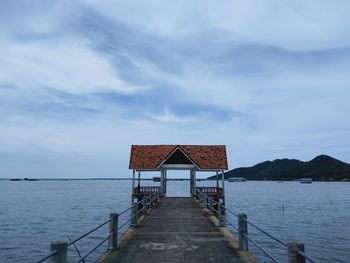 Pier over sea against sky