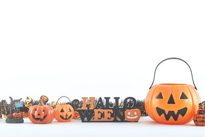 Close-up of halloween decorations against white background