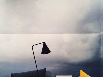 Low angle view of lamp post against the sky