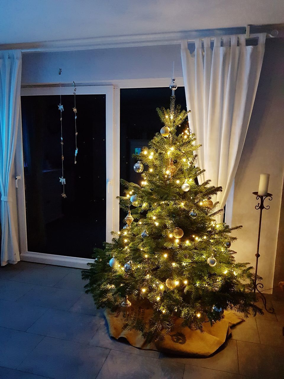 ILLUMINATED CHRISTMAS TREE ON BUILDING