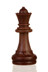 Close-up of chess pieces against white background