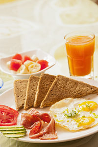 Breakfast plate with bacon, eggs, and brown toast in yangshuo