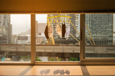 Reflection of building on glass window at home