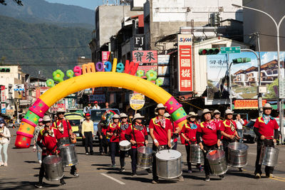 People standing on street in city