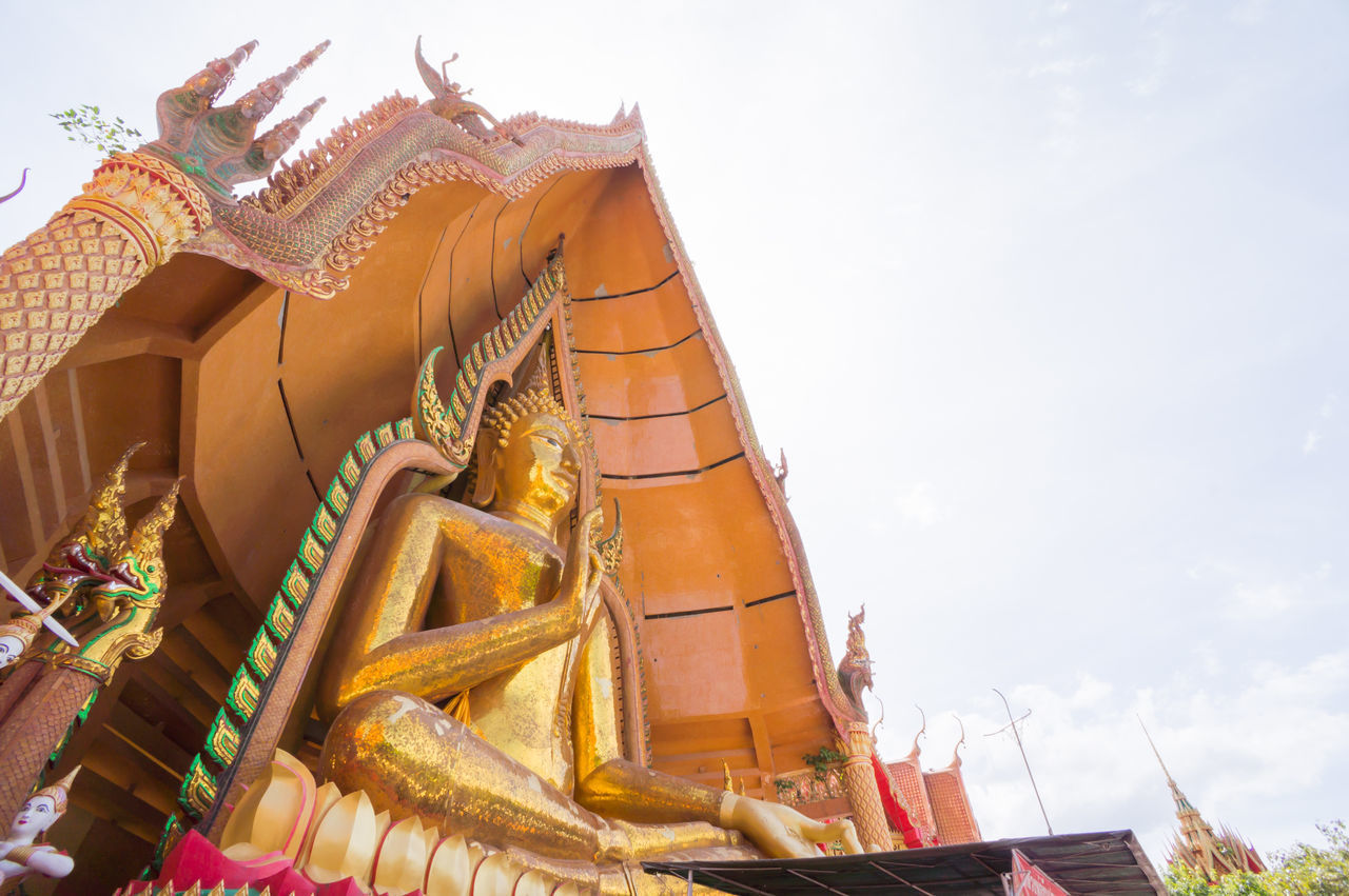 LOW ANGLE VIEW OF TEMPLE AGAINST BUILDING