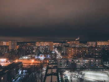 Illuminated buildings in city at night