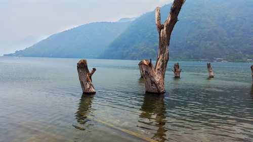 Scenic view of sea against mountain range