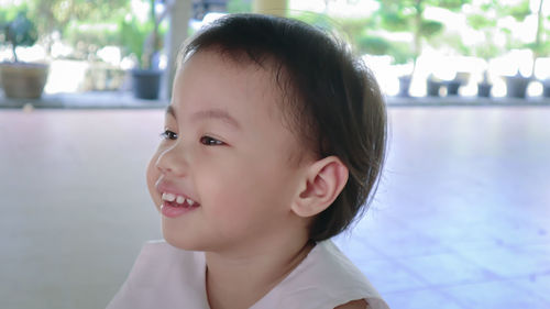 Portrait of cute girl looking away