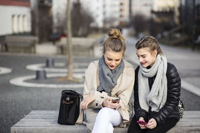 Teenage friends on bench