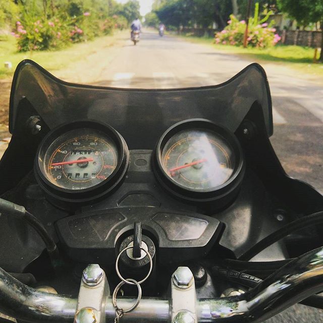 land vehicle, transportation, car, mode of transport, street, close-up, travel, motorcycle, part of, focus on foreground, car interior, retro styled, old-fashioned, road, day, side-view mirror, headlight, cropped, outdoors, stationary