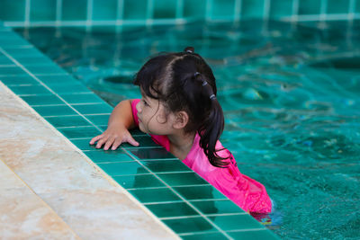 High angle view of girl in swimming pool