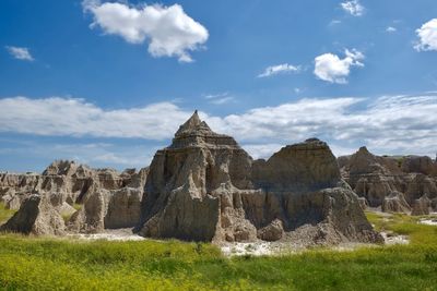 Rock formations on landscape against sky