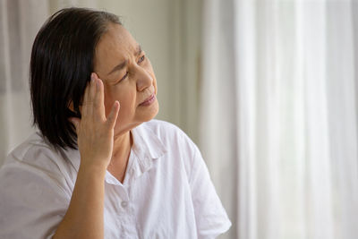 Portrait of beautiful woman with eyes closed