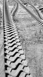 High angle view of railroad tracks on field