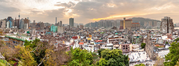 High angle view of buildings in city against sky