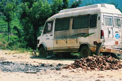 View of abandoned car on the road