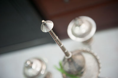 Close-up of metal on table