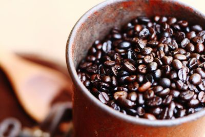 High angle view of roasted coffee beans in metal container