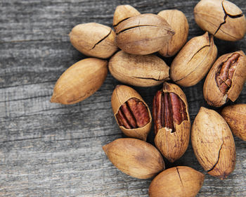 Pecan nuts on a old wooden table