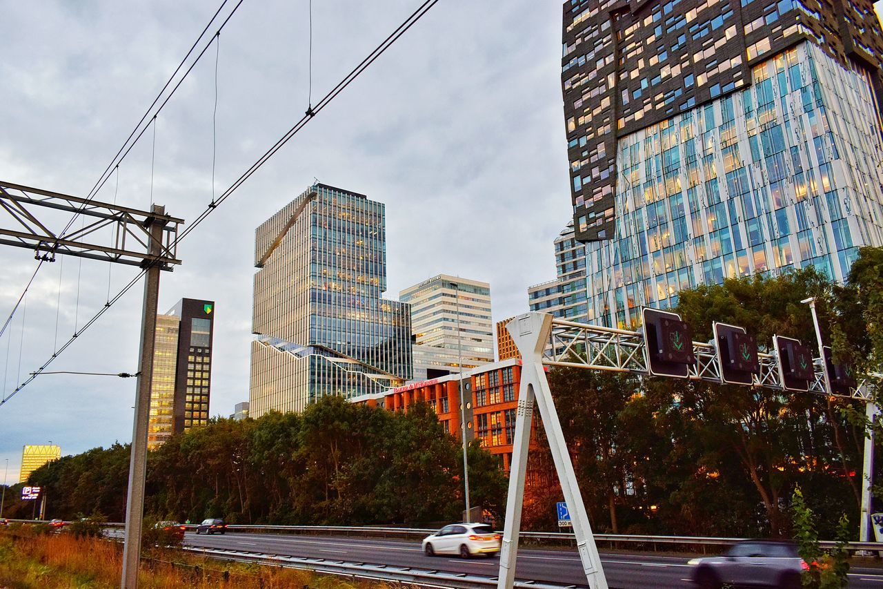 architecture, built structure, building exterior, sky, outdoors, low angle view, no people, city, cloud - sky, day