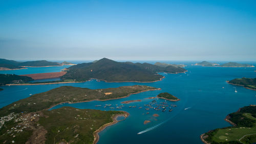 High angle view of bay against clear blue sky