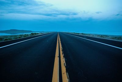 Empty road along landscape