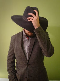 Portrait of man wearing cowboy hat